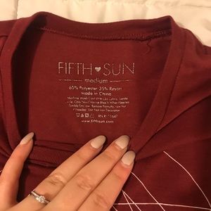 Red geometric logo tee